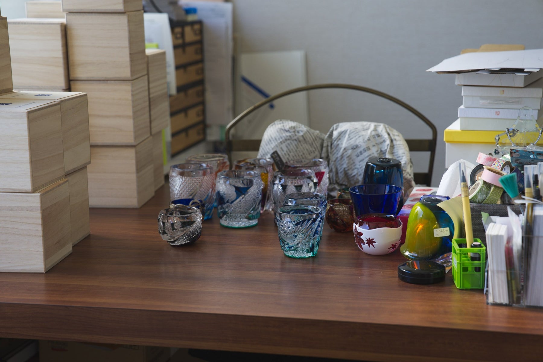 Cut-glass cups and bowls on a shelf at Haku Glass, Tokyo