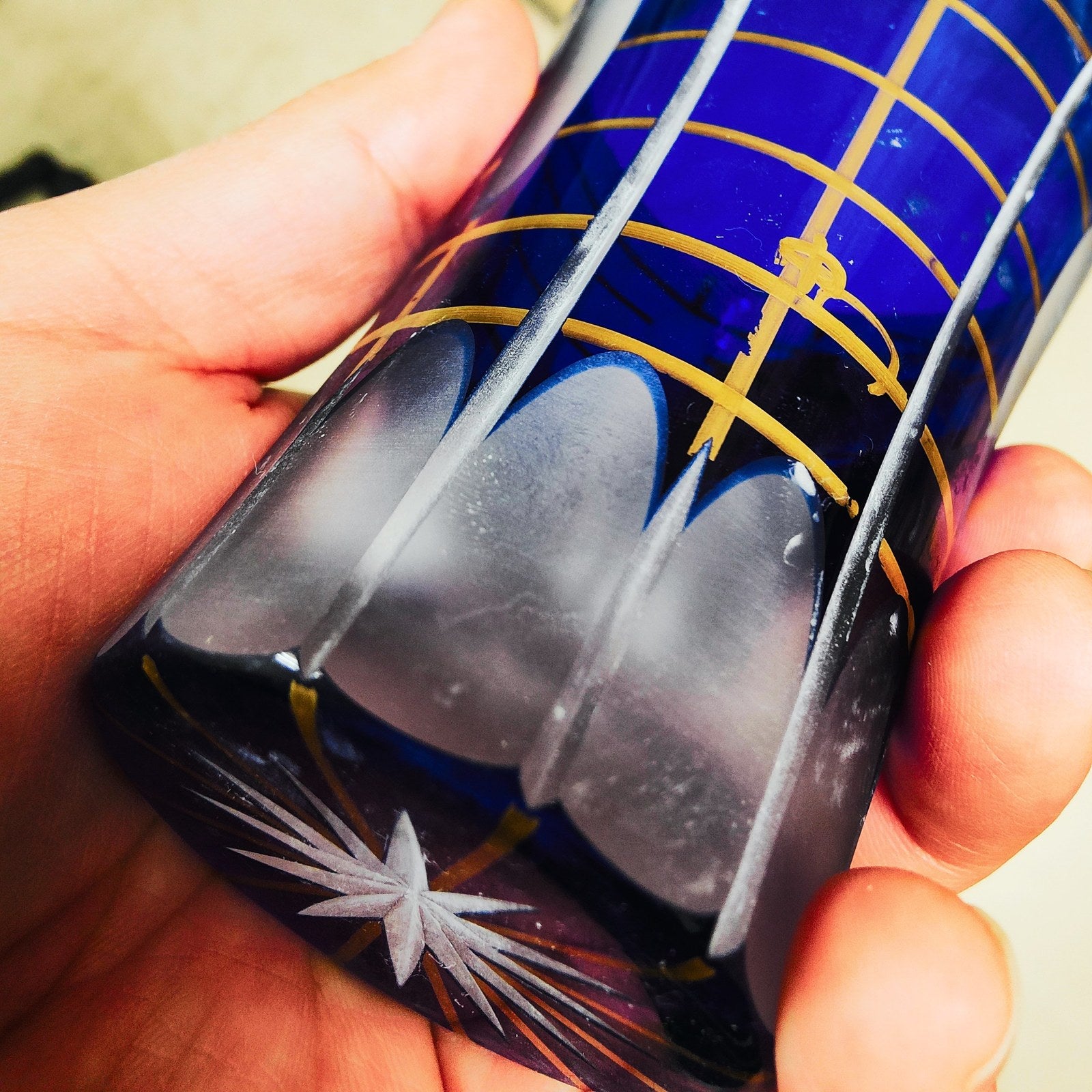 Edo Kiriko glass mid-cut, unpolished facets and gold overlay, held by hand, Rinzen, 8 April 2022